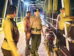 Polsek Kubu Tertibkan Parkir Kendaraan Pemancing di Jembatan Sei Kubu